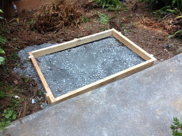 Dan and Sean leveled the form before securing it to the ground, and I filled the bottom with gravel