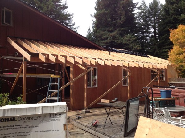 New roof and pathway overhang rafters in place