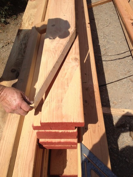 Rafter cut at two angles to butt properly into existing roof