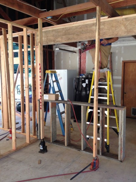 Joists jacked with Sean sliding in top plate