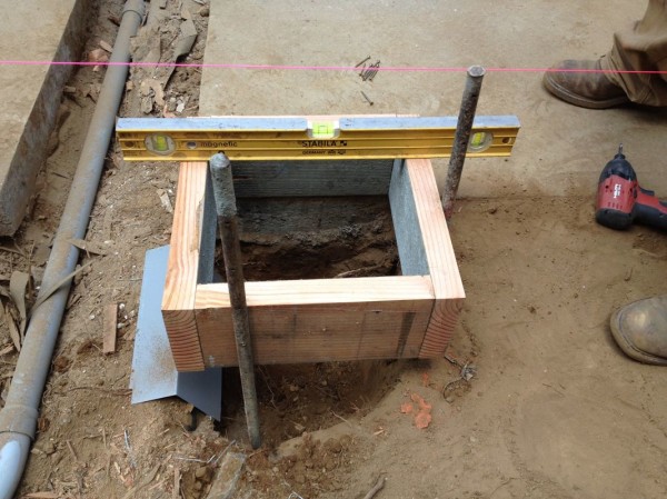Setting these boxes up exactly along the edge of the existing concrete path was tricky 