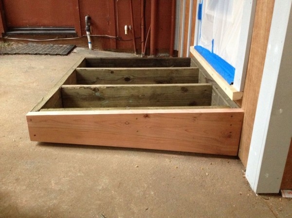 Sean custom cut these boards to sit 3/4" up from the concrete