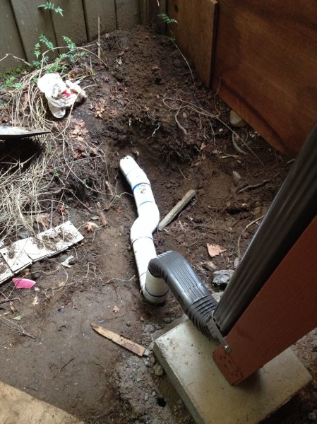 Sean craftily connected this new gutter to one of our old drains