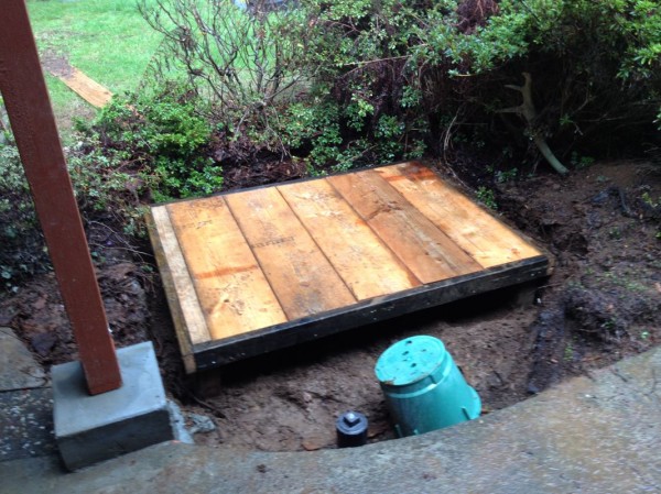 Box covered with 2"x12" boards left over from our concrete forms