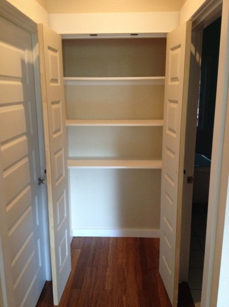 Simple shelves for hallway linen closet